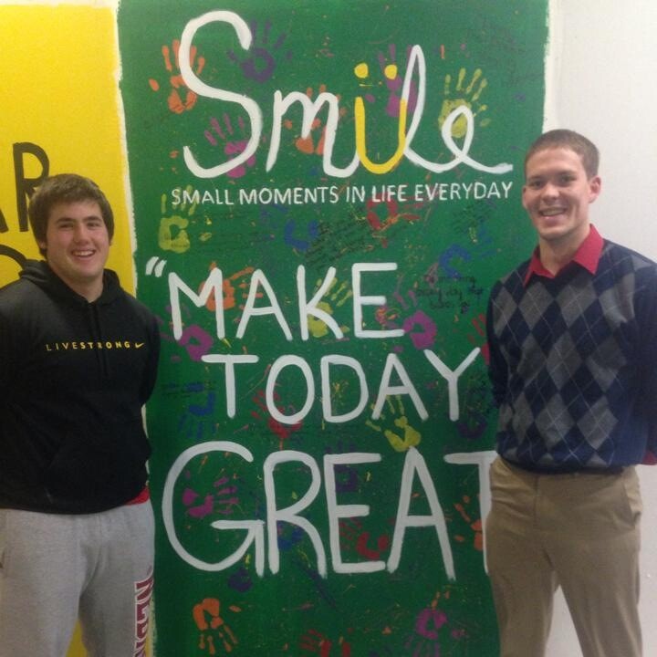 Junior Derek Vanlaningham (left) and graduate student Brock Rezny stand in front of the UNL SMILE mural during Nebraska Union construction last semester. 