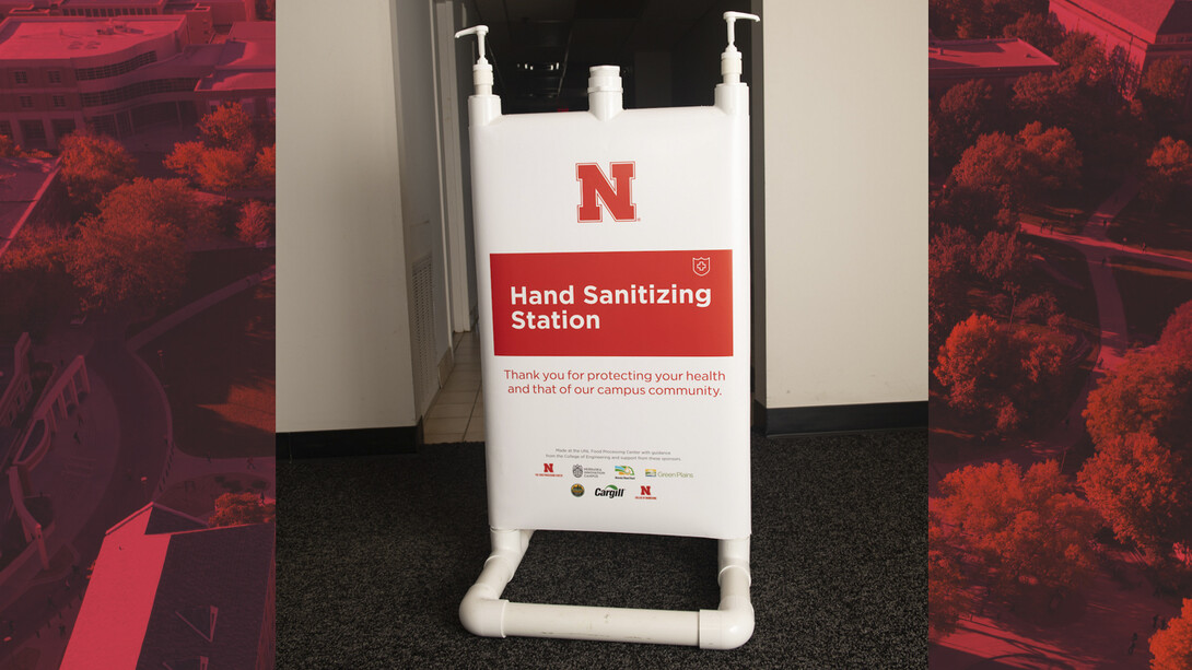 Hand sanitizer stations include signage that notes the donations and partnerships that made the project possible.