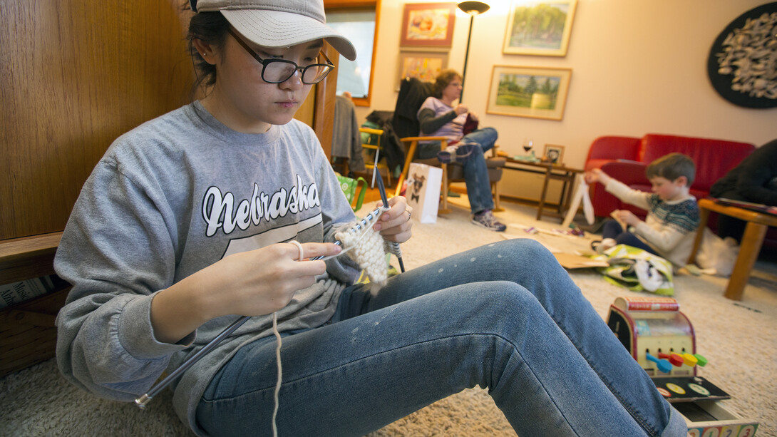 Yoojeong Lee, a junior from South Korea, was among three Nebraska art students who were among "Scarves for Kids" volunteers on Nov. 20.