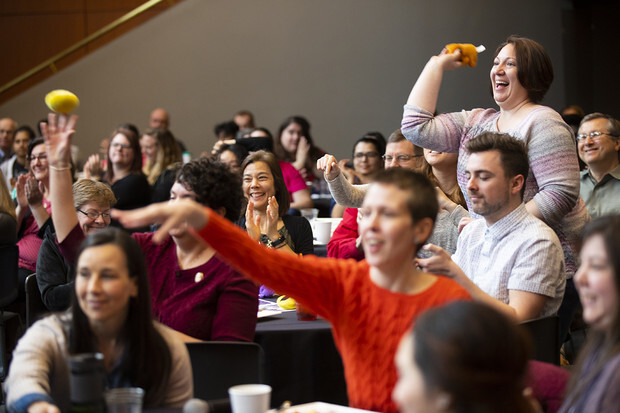 The crowd cheers and throws teddy bears at the 2019 Science Slam.