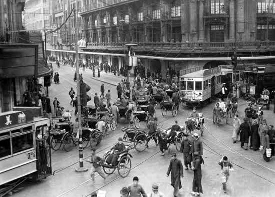 Photo of a street in Shanghai, China, circa 1940. This image is part University Archives and Special Collections' Arthur Smith collection and was featured in a Historypin blog.