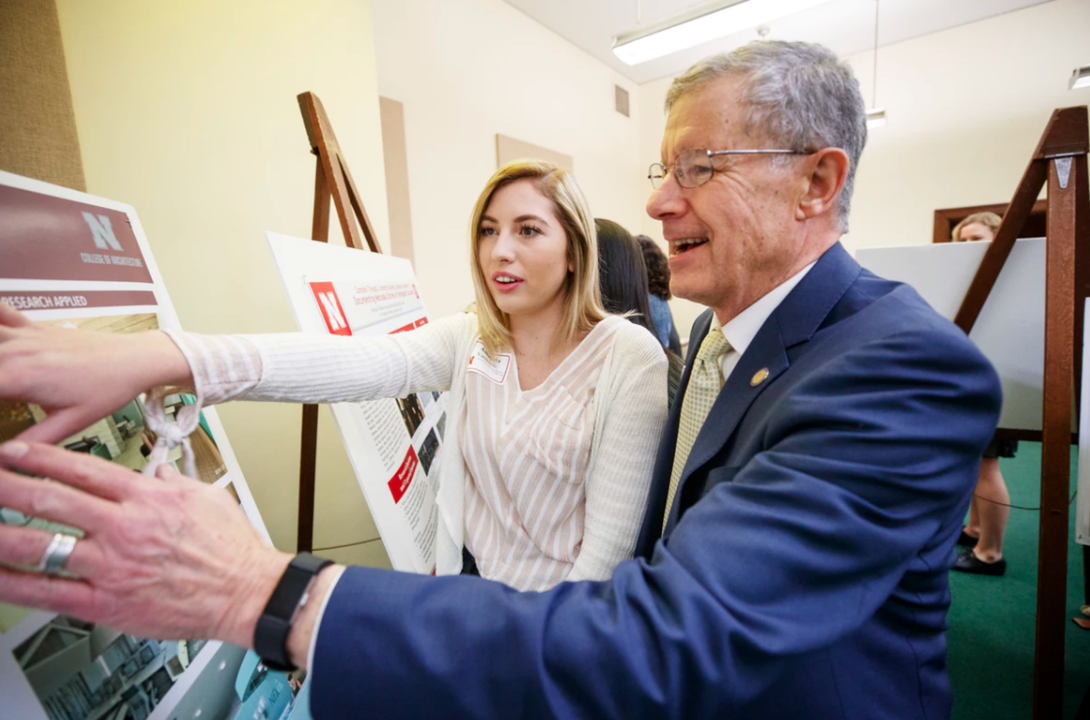 Sen. John S. McCollister and Amanda VanBuren discuss her research on the design of outpatient healthcare facilities.