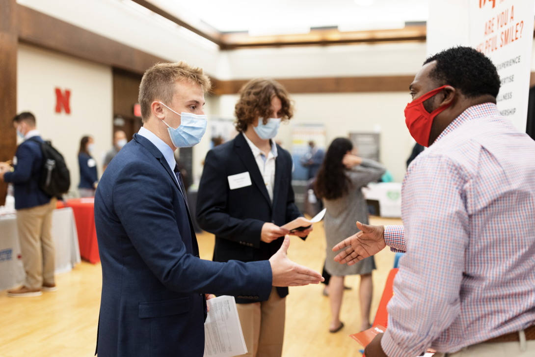 students talking at career fair