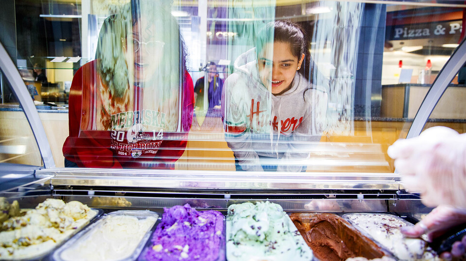 Students pick out gelato in the Abel-Sandoz Dining Center in this photo taken before face coverings were required when indoors on campus. The university has expanded availability of dining options for students this semester.