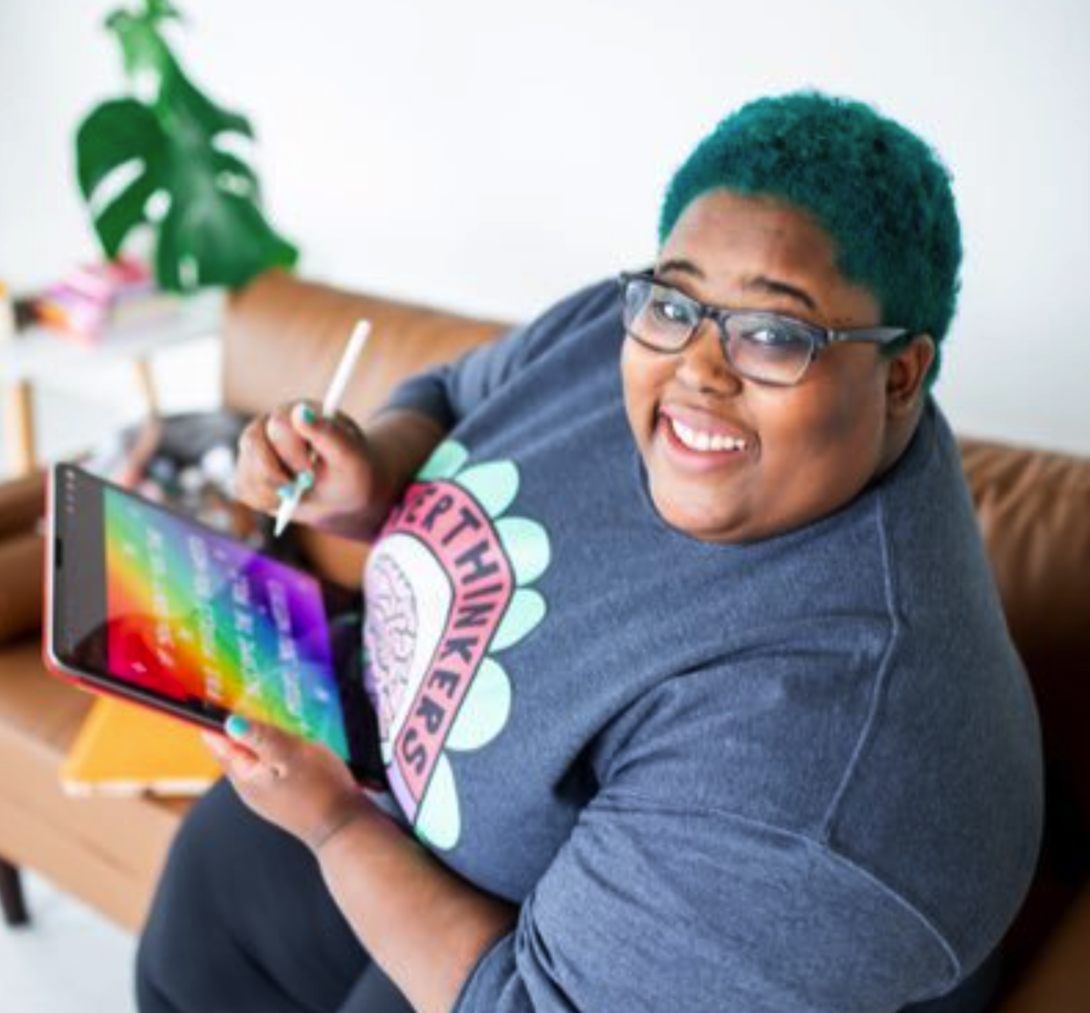 Photo of Nia Patterson sitting in a chair