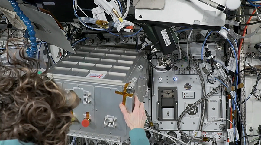 Astronaut and Flight Engineer Loral O’Hara pulled the spaceMIRA box to check connections, opened it to remove packing foam and closed it again.