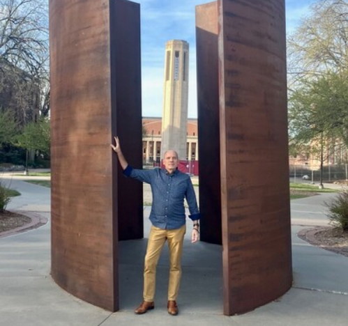 Paul Barnes stands inside the Richard Serra sculpture, “Greenpoint,” where he will perform a program of works by Philip Glass on May 1 to kick off Lincoln Calling.