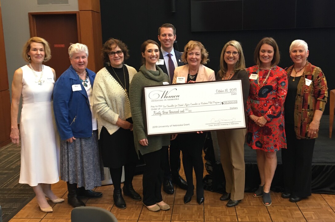 Nebraska's Counselor-in-Residence Program received a $93,000 grant from Women Investing in Nebraska on Oct. 16. Pictured at the event (from left) is Candy Henning, Ann Bruntz, Connie Boehm, Vanessa Neuhaus, Jake Johnson, Laurie Bellows, Tricia Besett-Alesch, Susan Rosenlof and Linda Hoegemeyer.