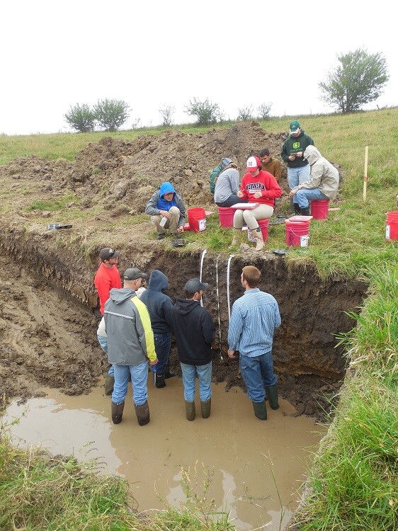 Members of the UNL Soil Judging Team analyze soils in a practice pit at the Region 5 contest in Ames, Iowa. (Photo courtesy Becky Young)