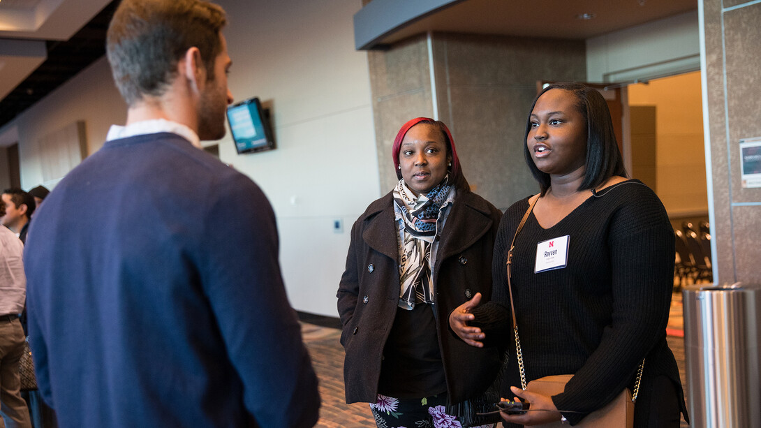 Family members talk with media following the Nebraska Achievement Recognition Program. All students received a guarantee for a tuition scholarship offer for the 2019-2020 academic year.