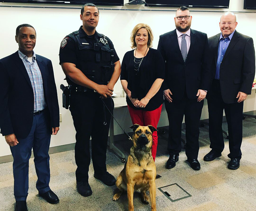 The University Police Department recently presented annual awards to its employees. Pictured (from left) is Hassan Ramzah, assistant chief of police; Russ Johnson, K-9 police officer, and partner, Layla; Gina Hotovy, financial specialist; Zach Fischer, dispatcher; and Owen Yardley, chief of police.  