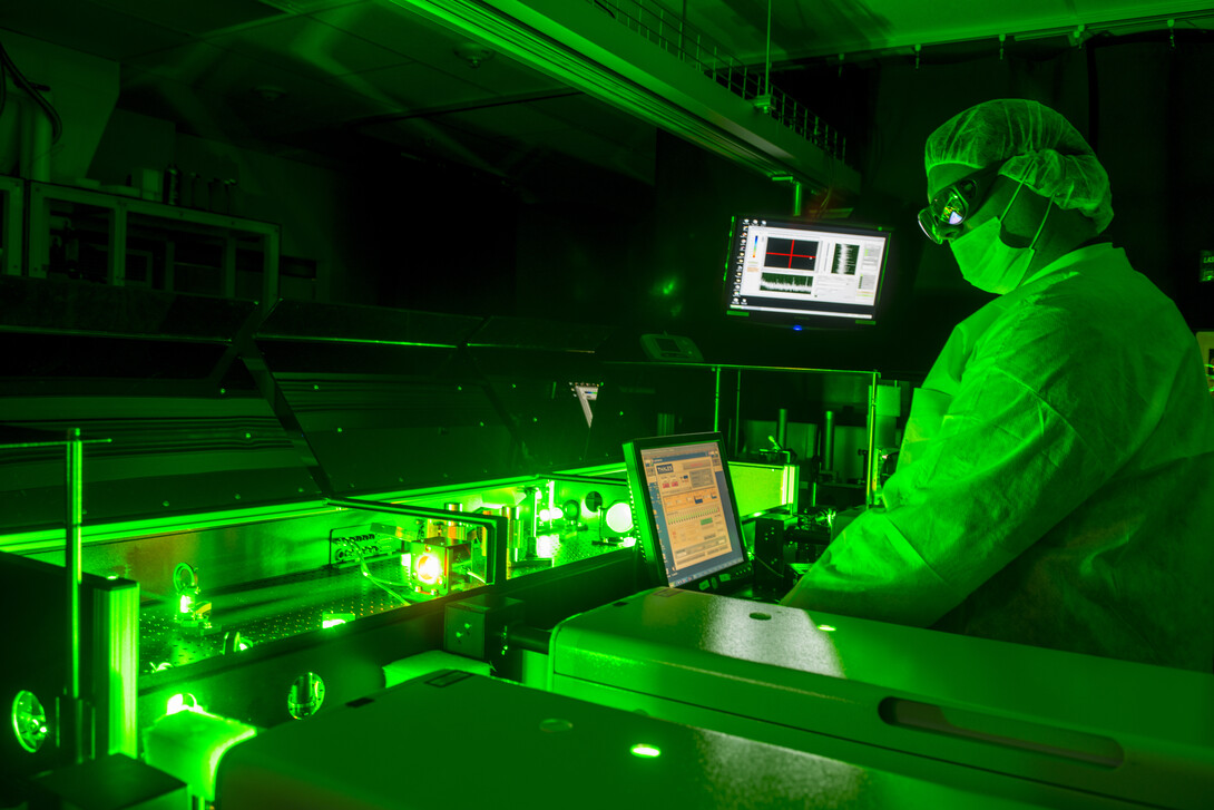 A scientist works with lasers in the Diocles Extreme Light Laboratory.