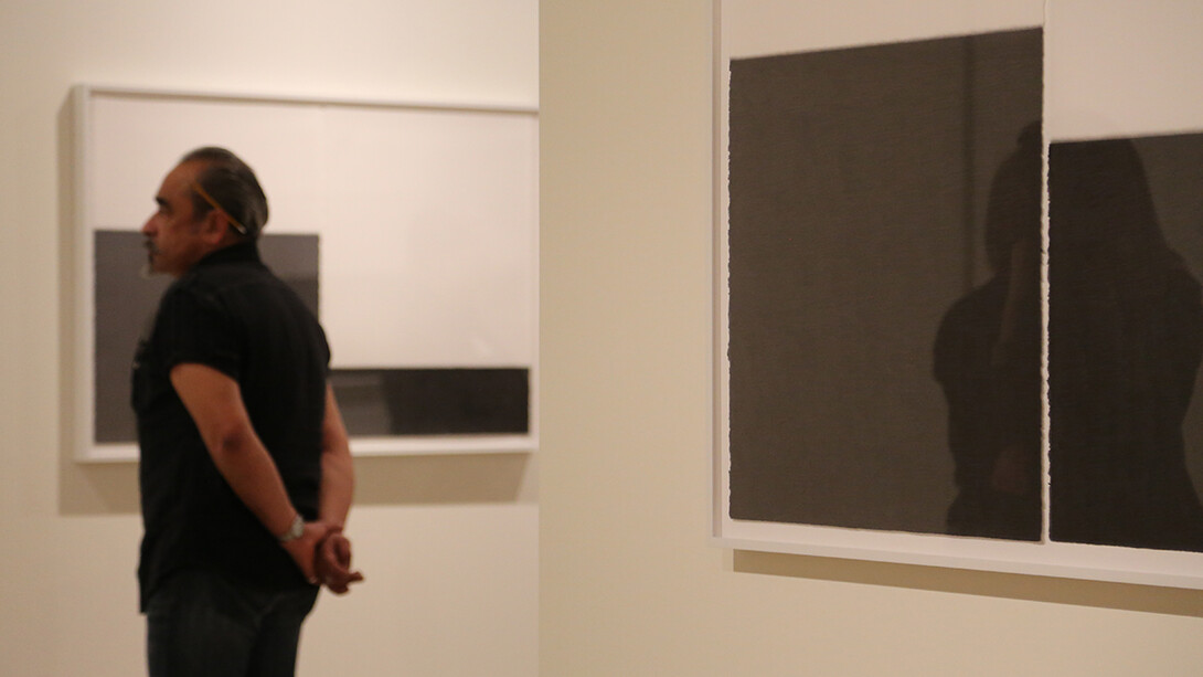 A museum visitor explores "The Unfolding Center" exhibition at UNL's Sheldon Museum of Art. The exhibit is open through May 8.