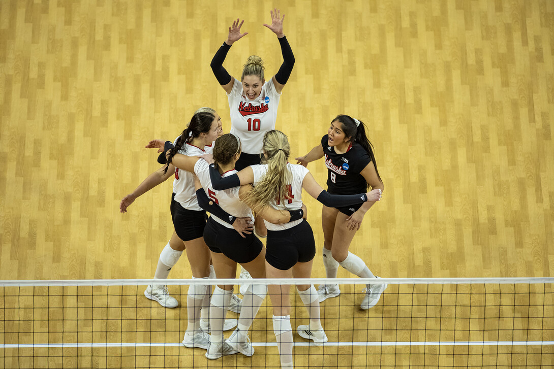 Husker celebrate a point against Kansas.