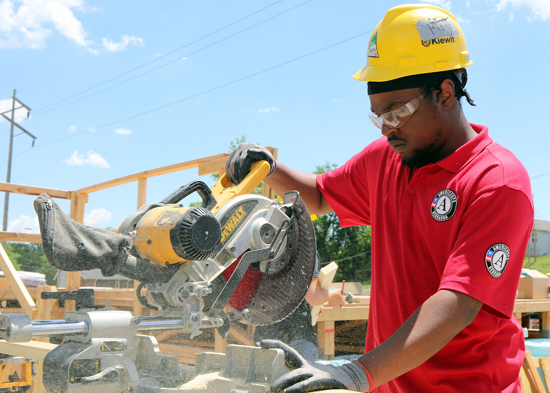 An AmeriCorps member works on a project in Omaha.