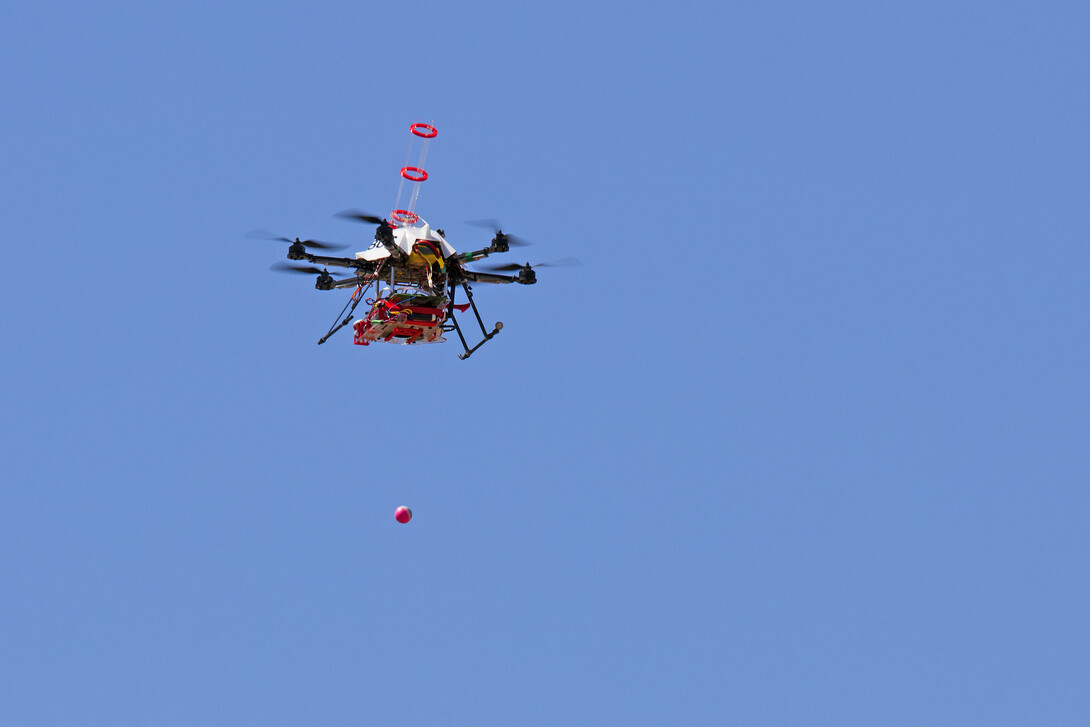 The drone drops a fire ball during the April 22 test. The device was the fourth prototype developed by UNL's Sebastian Elbaum and Carrick Detweiler; a couple more versions are likely within the next couple years. The drones previously had been tested indoors and on private land. 
