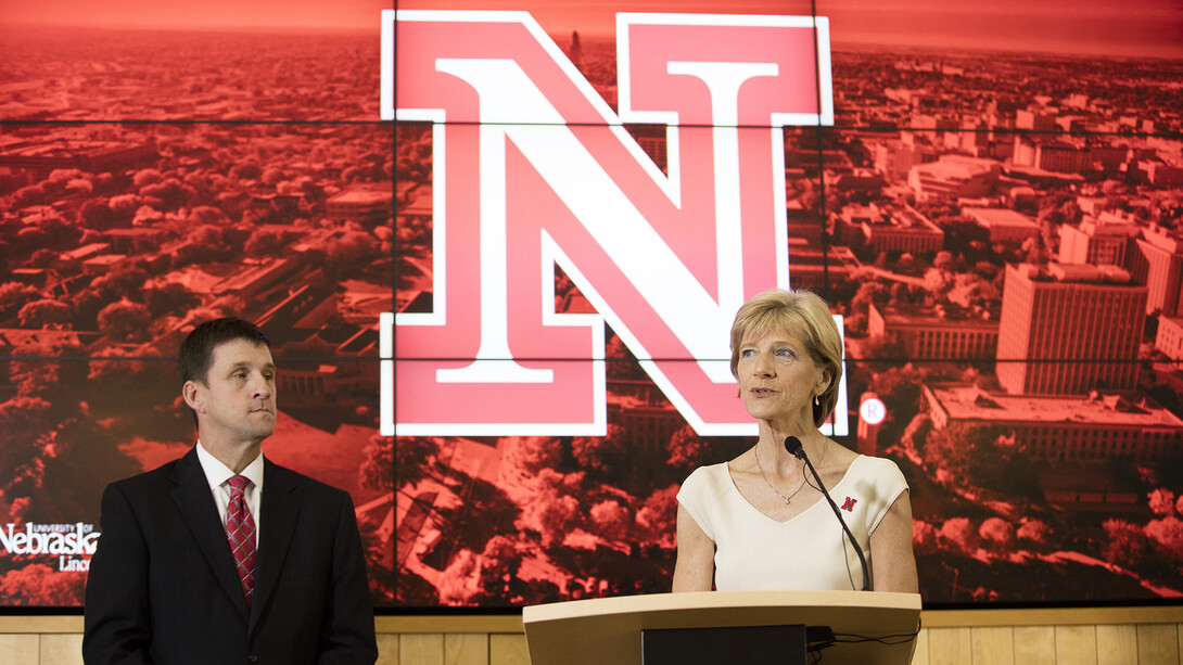 UNL's Sue Sheridan, who chaired the chancellor search committee, and Hank Bounds, University of Nebraska president, discuss the search process before Ronnie Green was introduced as UNL's new leader.