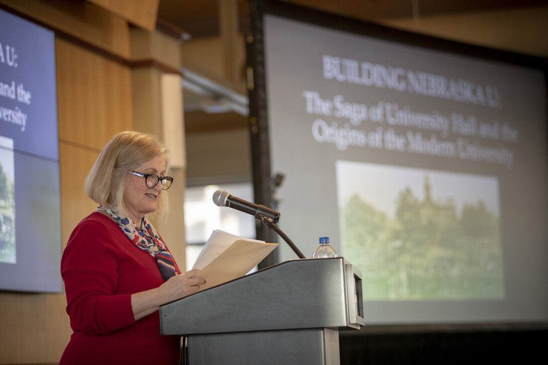 Kay Logan-Peters opens her Nebraska Lecture on Feb. 12. The talk examined stories about the buildings as well as the people who helped design, build and use them.