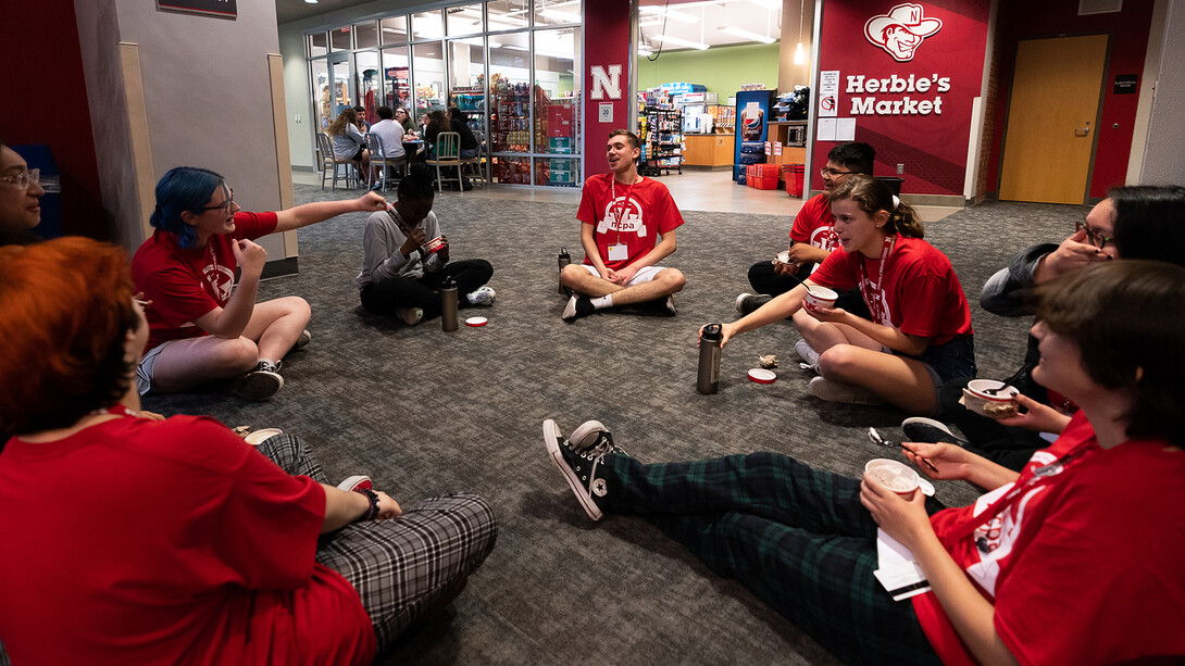 Scholars pause to enjoy time together and a few bites of ice cream outside of Herbie’s Market in Abel Hall on June 9.