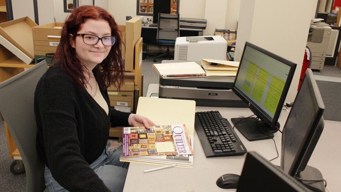 Kierra Dunnam, a sophomore majoring in history with minors in anthropology and queer studies, works during her internship with University Libraries Archives & Special Collections
