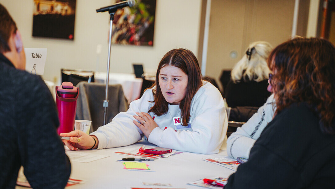 Participants work through an exercise during an HR workshop.
