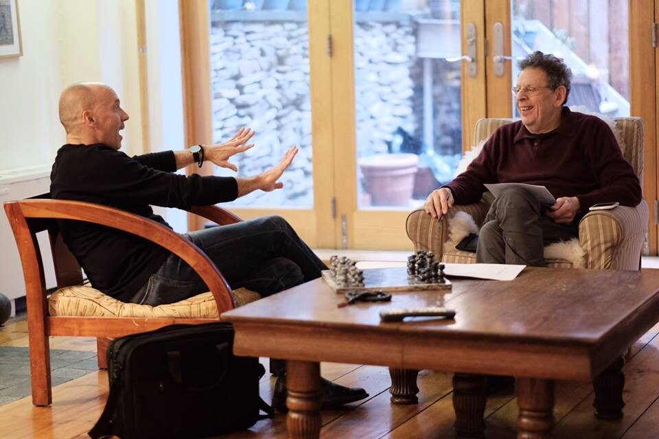 Paul Barnes (left) visits with composer Philip Glass in New York in January.