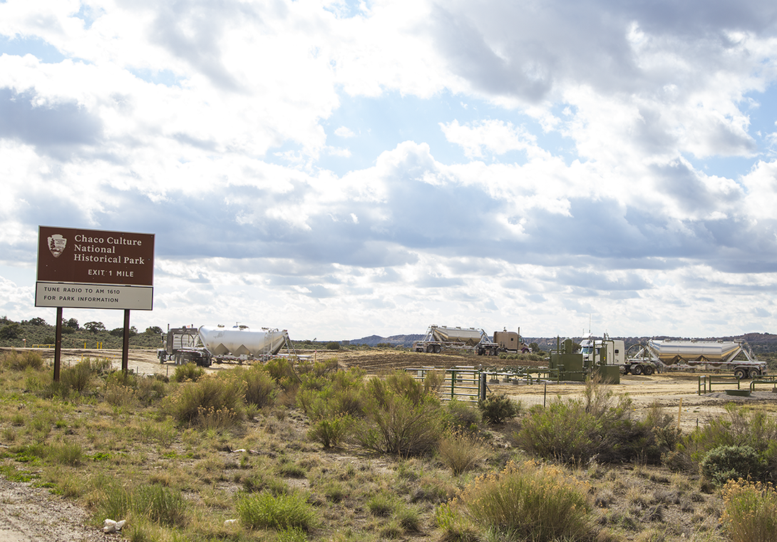 Oil trucks can be seen parked just outside the borders of Chaco Culture National Park in New Mexico.