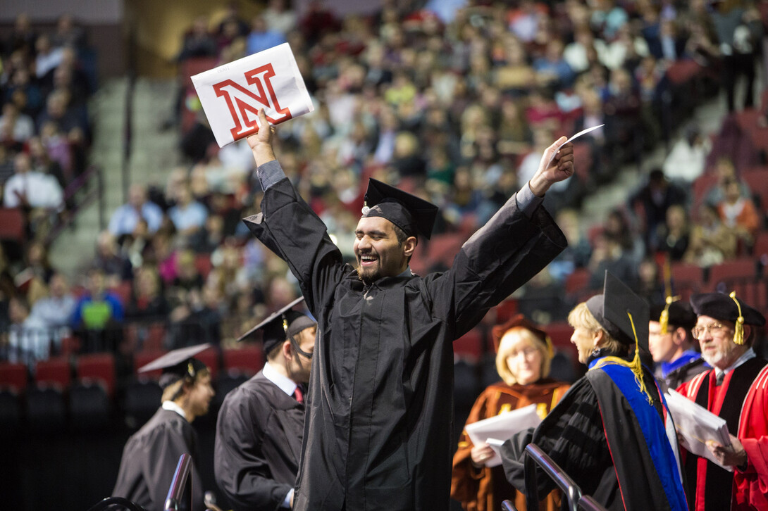 James Aguero of Houston celebrates his College of Business Administration degree.