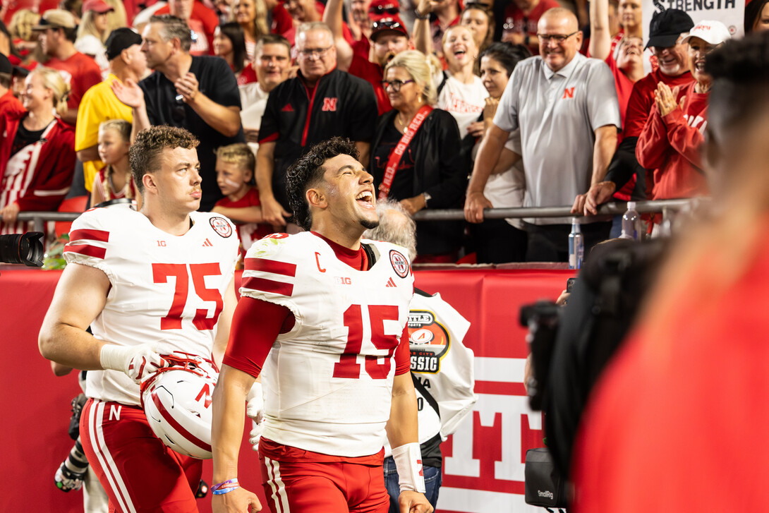 Dylan Raiola (15) yells toward the crowd at Arrowhead Stadium.