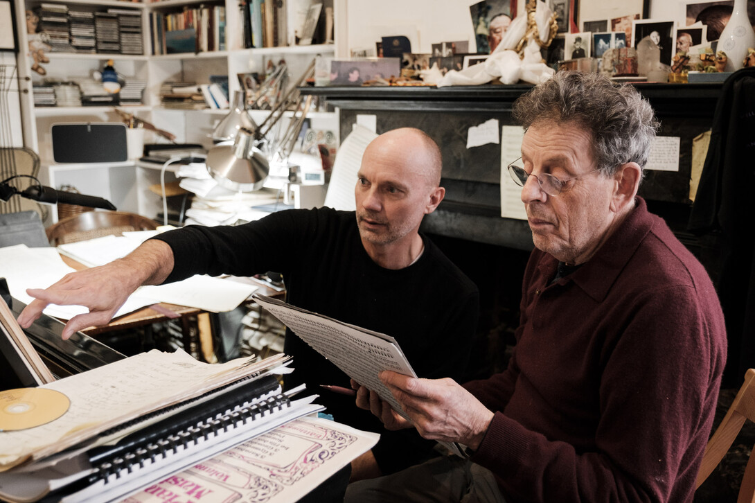 Paul Barnes (left) and Philip Glass review the score for "Annunciation."