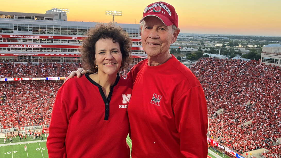 Kayleen Walsh and her husband in Memorial Stadium for a Husker football game.