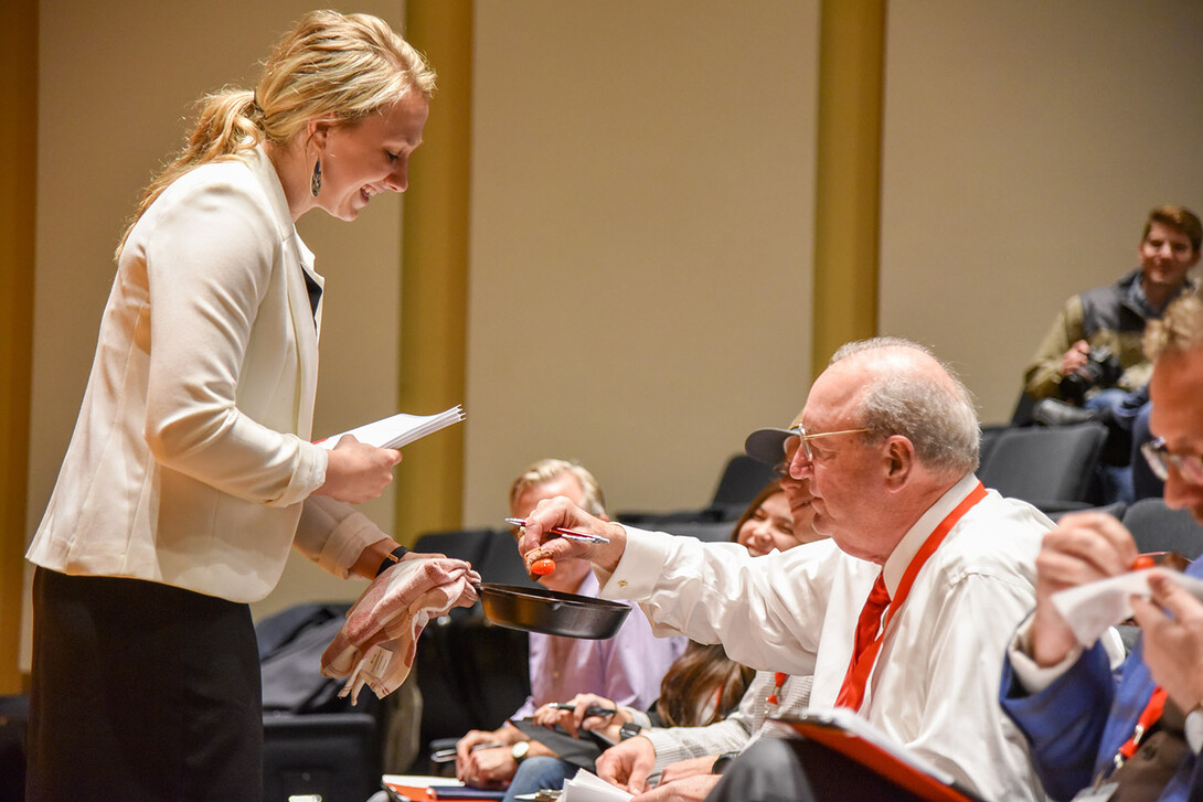 Hannah Esch shares with the judges food samples from her business, Oak Barn Beef, during the final round of the 2019 New Venture Competition.