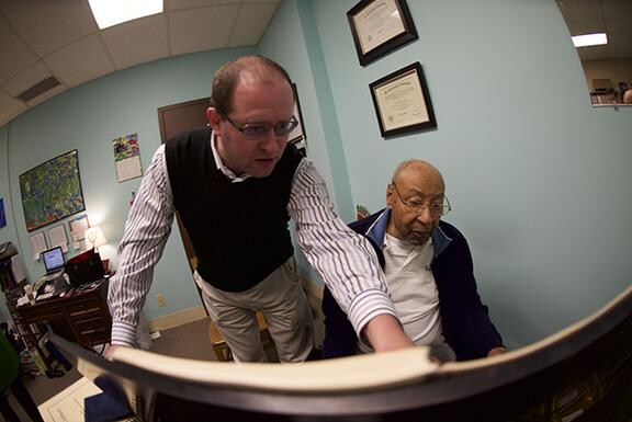 Pianist Denis Plutalov asks a question of composer Robert Owens during Owens’ visit to UNL in March. Photo by Michael Reinmiller.