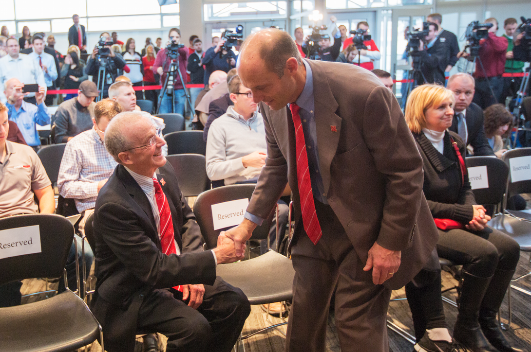 Chancellor Harvey Perlman (left) greets Husker head football coach Mike Riley.