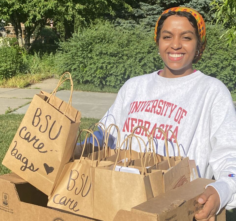 Batool Ibrahim smiles as she carries Black Student Union Care Bags that were distributed to community members in need. The project continues to seek donations.