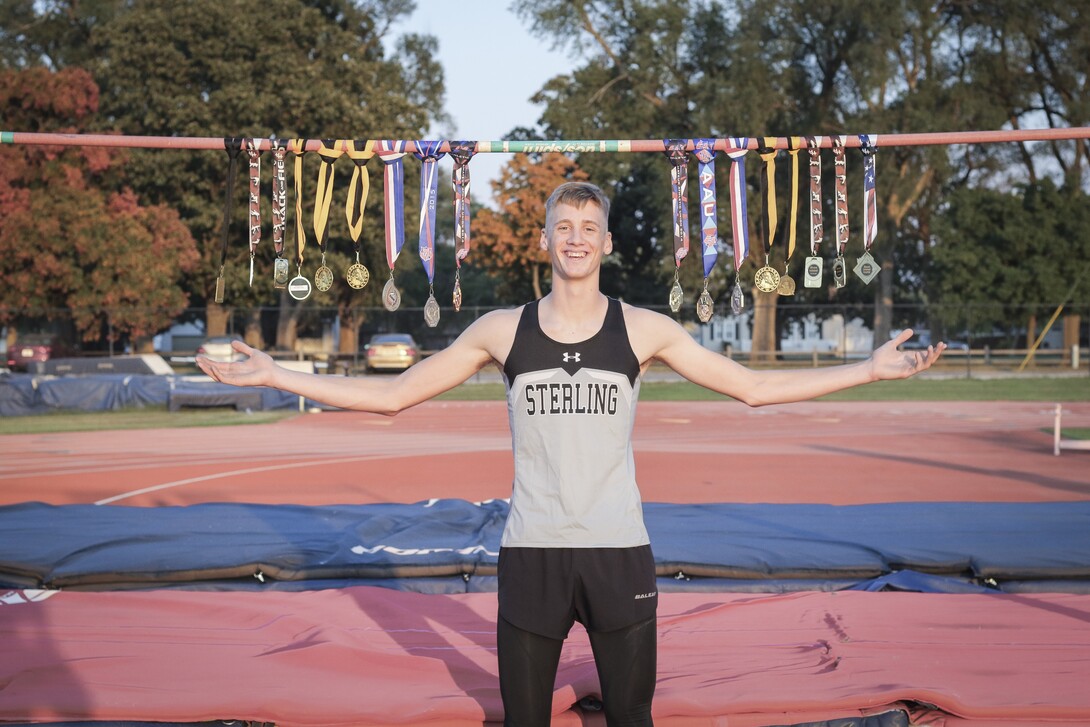 Tyus Wilson poses with this track medals his senior year of high school.