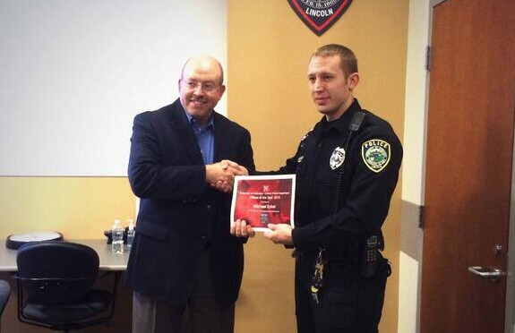 Chief Owen Yardley (left) congratulates Officer Michael Eckel, UNLPD's Officer of the Year.