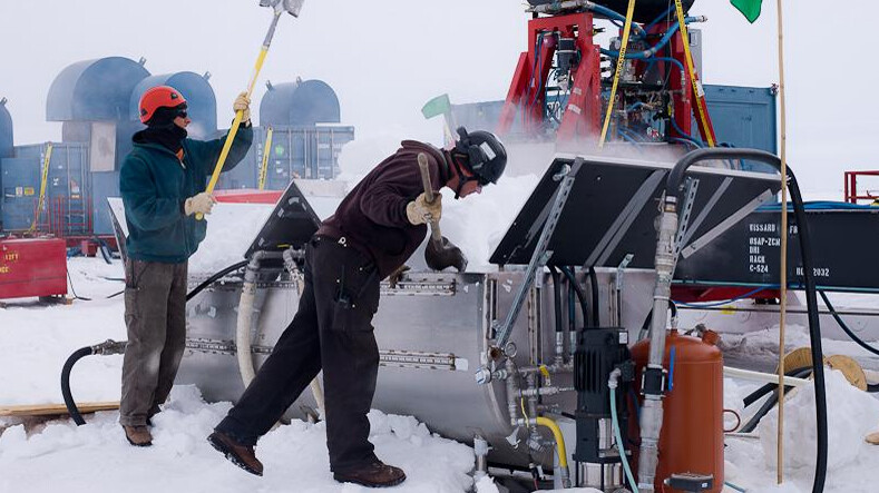 UNL drillers Daren Blythe and Dar Gibson shovel snow into a melter that provides water for the hot water drill that melted a hole through 800 meters of ice on top of subglacial Lake Whillans.